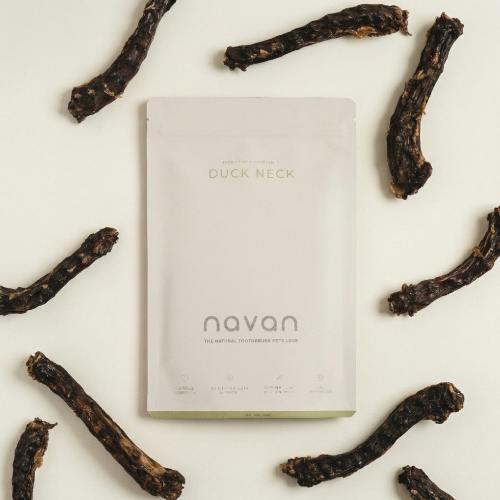 duck neck aerial flat-lay — bag with chews scattered