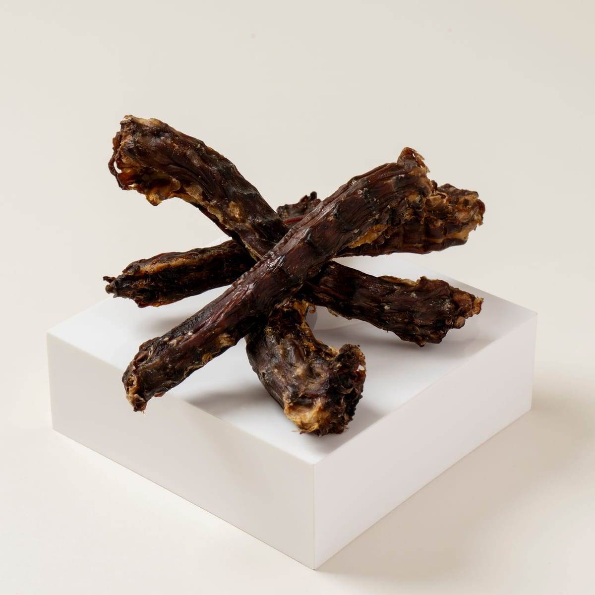 Whole dehydrated duck necks — the longest-lasting chew in the small-dog protocol
