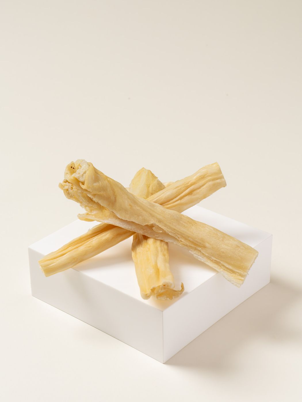 navan single-ingredient rabbit stick chews on a pedestal