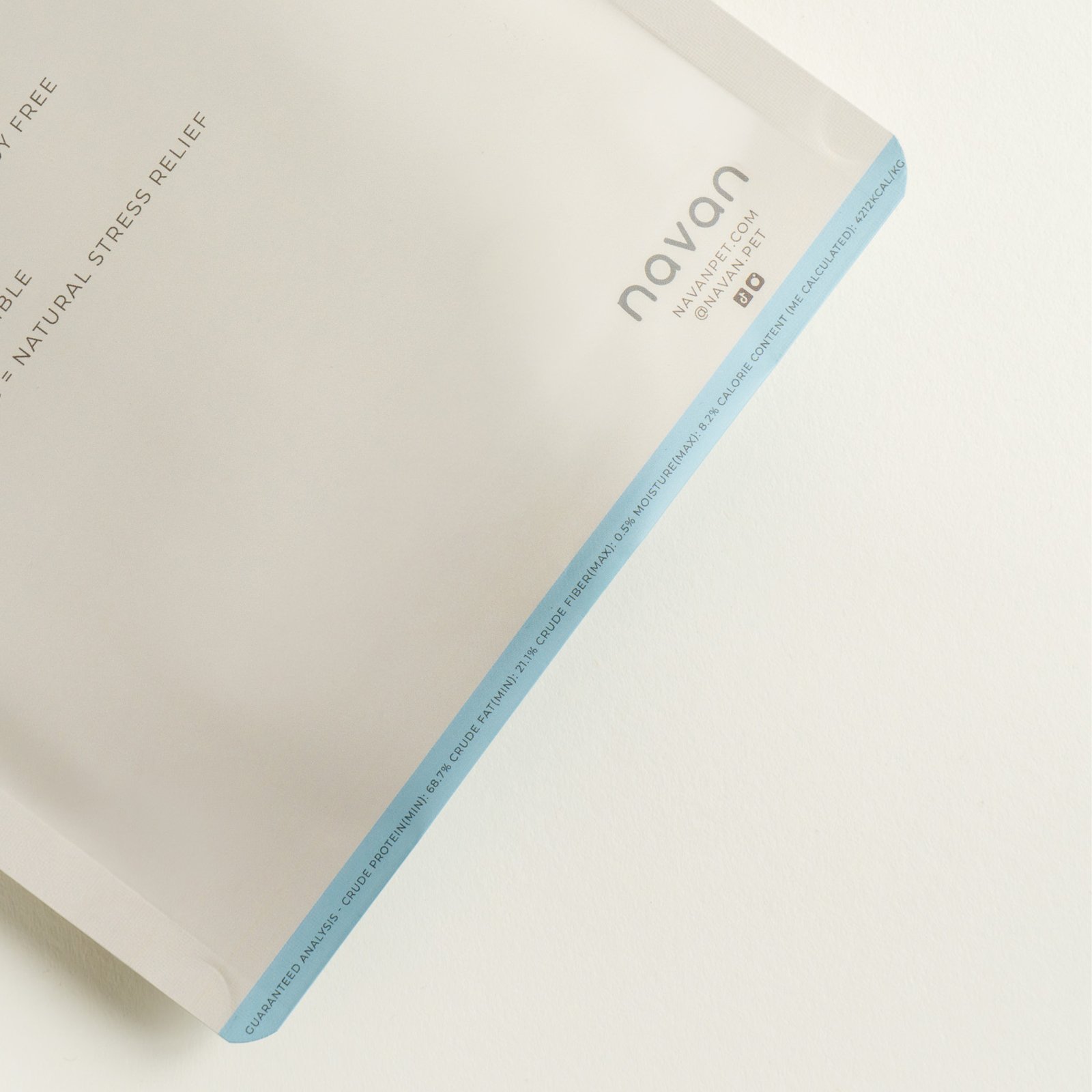 rabbit ears bag corner detail — sky-blue trim, navan wordmark