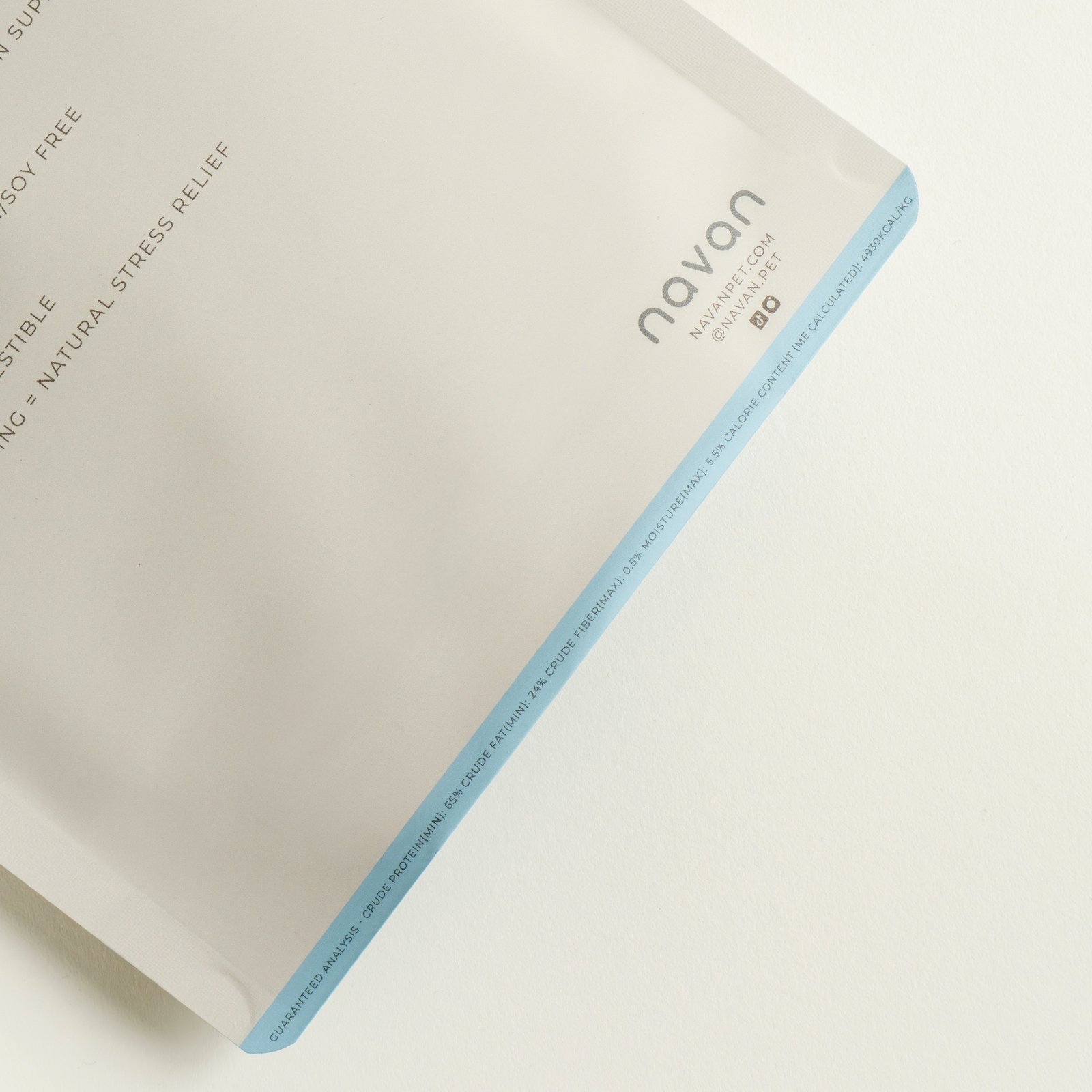 rabbit stick bag corner detail — sky-blue trim, navan wordmark