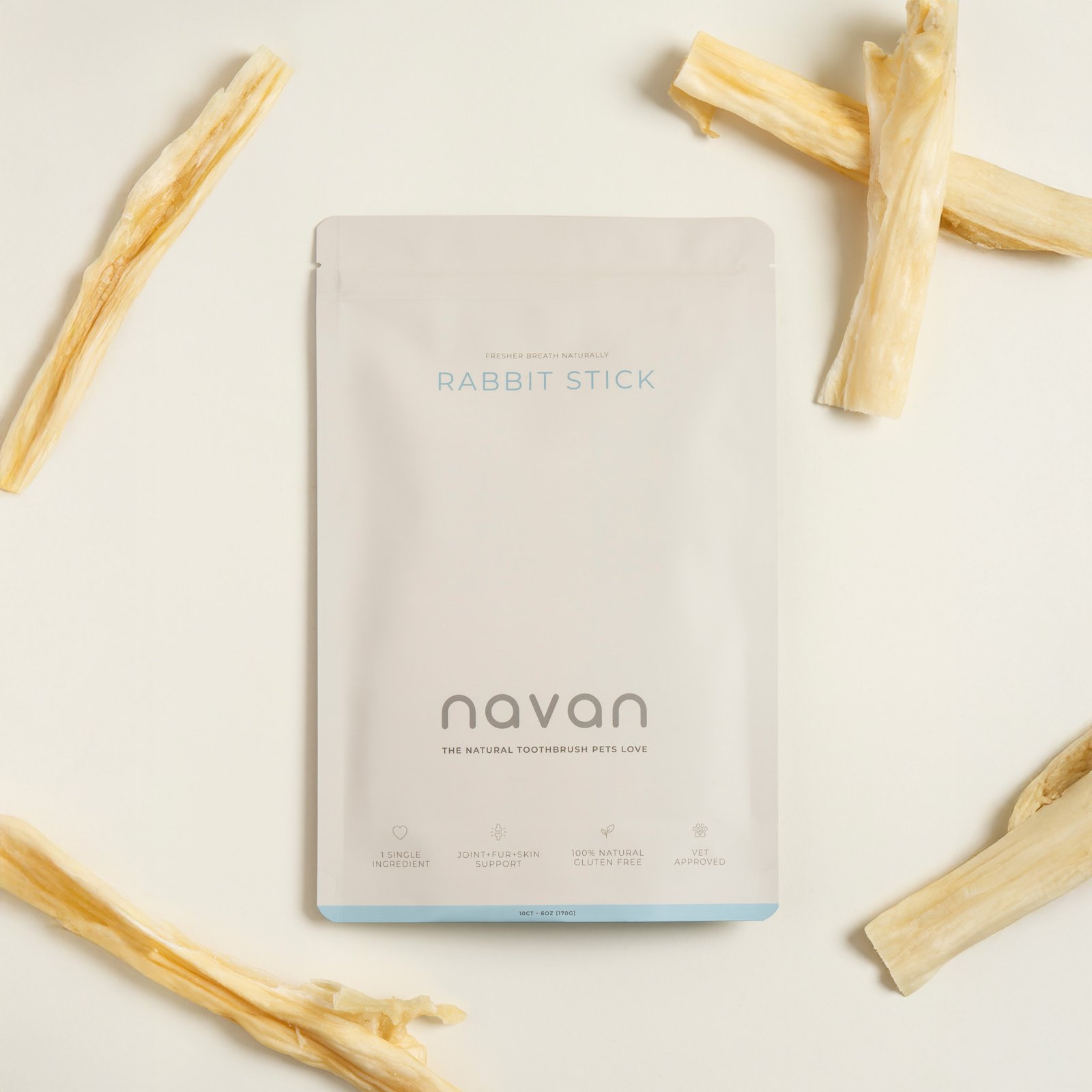 rabbit stick aerial flat-lay — bag with chews scattered